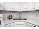 Modern kitchen with granite countertop and stainless steel sink at 6 Preakness Dr, Durham, NC 27713