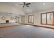 Spacious bonus room with a full wall mirror and many large windows offering lots of light at 6016 Glenthorne Dr, Raleigh, NC 27613