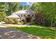 Elegant brick home with meticulously landscaped front yard and a welcoming entrance, perfect for curb appeal at 6016 Glenthorne Dr, Raleigh, NC 27613