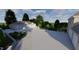 Beautiful home exterior featuring an expansive driveway and a well-manicured lawn at 6016 Glenthorne Dr, Raleigh, NC 27613