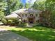 Stunning two-story home with a lush green lawn and mature trees, perfect for outdoor enjoyment at 6016 Glenthorne Dr, Raleigh, NC 27613