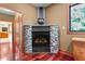 A decorative stone fireplace with a stone hearth in the corner of a naturally lit room at 6016 Glenthorne Dr, Raleigh, NC 27613