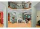 Grand foyer with high ceilings, decorative ironwork, and hardwood floors, leading to the living areas at 6016 Glenthorne Dr, Raleigh, NC 27613