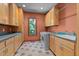 Functional laundry room with ample cabinet space, sink, and modern washer and dryer at 6016 Glenthorne Dr, Raleigh, NC 27613