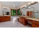 Bright main bathroom featuring double sinks, and a soaking tub beneath large windows at 6016 Glenthorne Dr, Raleigh, NC 27613