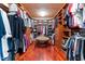Spacious walk-in closet with custom built-in shelving and storage for organization at 6016 Glenthorne Dr, Raleigh, NC 27613