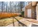 Backyard space with a small fence, patio, and proximity to mature trees, perfect for relaxation at 602 Walnut Woods Dr # 62, Morrisville, NC 27560