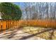 Fenced backyard offering privacy and space for outdoor activities and landscaping at 602 Walnut Woods Dr # 62, Morrisville, NC 27560