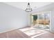 Bright dining room featuring a modern chandelier and sliding glass doors to the backyard at 602 Walnut Woods Dr # 62, Morrisville, NC 27560
