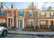 Charming townhome with stone accents, neutral siding, and blue shutters at 602 Walnut Woods Dr # 62, Morrisville, NC 27560