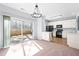 Bright dining room off the kitchen with sliding glass doors to outdoor fenced in area at 602 Walnut Woods Dr # 62, Morrisville, NC 27560