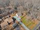 Overhead view of a home nestled among trees with a private driveway at 612 Miller Rd, Hillsborough, NC 27278