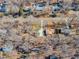Aerial view of a residential neighborhood with tree-lined streets and diverse homes at 612 Miller Rd, Hillsborough, NC 27278