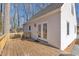 View of the home's back deck with access to the house through glass doors at 612 Miller Rd, Hillsborough, NC 27278
