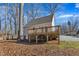 Home exterior featuring a wooden deck and beautiful backyard scenery at 612 Miller Rd, Hillsborough, NC 27278