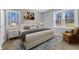 Staged bedroom with wood floors, area rug, and natural light at 612 Miller Rd, Hillsborough, NC 27278