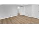Bedroom featuring wood flooring, natural light, and closet at 612 Miller Rd, Hillsborough, NC 27278