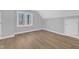 Bedroom featuring wood flooring and natural light from a window at 612 Miller Rd, Hillsborough, NC 27278