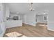 Open-concept kitchen with white cabinets, an island, and stainless steel appliances at 612 Miller Rd, Hillsborough, NC 27278