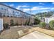 Back yard featuring a concrete patio and a retaining wall at 640 Newlyn Dr, Raleigh, NC 27606