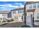 A view of the backyard of a two-story home with an outdoor patio and partially fenced yard at 640 Newlyn Dr, Raleigh, NC 27606