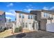 A view of the backyard of a two-story home with an outdoor patio and partially fenced yard at 640 Newlyn Dr, Raleigh, NC 27606