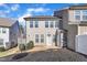 A view of the backyard of a two-story home with an outdoor patio and partially fenced yard at 640 Newlyn Dr, Raleigh, NC 27606