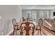 Dining room with wood floors open to living room at 640 Newlyn Dr, Raleigh, NC 27606