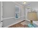 Bright entryway showcasing beautiful wood floors, decorative trim and a white door with a window at 640 Newlyn Dr, Raleigh, NC 27606