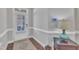 Inviting entryway with a white door and wood floors, featuring decorative trim and a modern security system at 640 Newlyn Dr, Raleigh, NC 27606