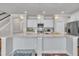 Bright kitchen with granite countertops, stainless appliances, and white cabinets at 640 Newlyn Dr, Raleigh, NC 27606