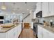 Open kitchen featuring stainless steel appliances and granite countertops at 640 Newlyn Dr, Raleigh, NC 27606