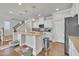 Bright kitchen with granite countertops, stainless appliances, and wood flooring at 640 Newlyn Dr, Raleigh, NC 27606
