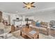 Open living room with wood floors connecting to kitchen at 640 Newlyn Dr, Raleigh, NC 27606