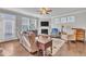 Cozy living room with fireplace, wood floors, and natural lighting at 640 Newlyn Dr, Raleigh, NC 27606