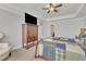 Comfortable main bedroom with a ceiling fan, natural lighting, and hardwood furniture at 640 Newlyn Dr, Raleigh, NC 27606