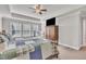 Comfortable main bedroom with a ceiling fan, natural lighting, and hardwood furniture at 640 Newlyn Dr, Raleigh, NC 27606