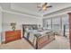 Spacious main bedroom featuring a tray ceiling, ceiling fan, and plenty of natural light at 640 Newlyn Dr, Raleigh, NC 27606