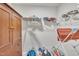 Walk-in closet featuring wood storage cabinet and wire shelving at 640 Newlyn Dr, Raleigh, NC 27606