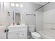 Bathroom with a white vanity, updated fixtures, and shower with tub at 6734 Chauncey Dr, Raleigh, NC 27615