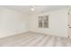 Bright bedroom featuring a ceiling fan and a window with natural light at 6734 Chauncey Dr, Raleigh, NC 27615
