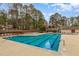 Large community pool with multiple lanes and lounge chairs, ideal for recreation and relaxation at 6734 Chauncey Dr, Raleigh, NC 27615
