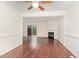 Dining area with hardwood floors and a ceiling fan, open to the living room and kitchen, perfect for entertaining at 6734 Chauncey Dr, Raleigh, NC 27615