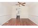 Dining room featuring hardwood floors and a view of the kitchen, creating a seamless flow between spaces at 6734 Chauncey Dr, Raleigh, NC 27615