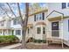 Townhouse complex featuring vinyl siding, shuttered windows, and front entrances at 6734 Chauncey Dr, Raleigh, NC 27615