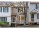 Charming townhouse featuring vinyl siding, shuttered windows, and a cozy front porch at 6734 Chauncey Dr, Raleigh, NC 27615