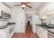 Functional kitchen featuring white appliances, ample cabinetry, and seamless transition into the living space at 6734 Chauncey Dr, Raleigh, NC 27615