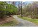 Winding walking trail through a tranquil wooded area, perfect for nature lovers and outdoor enthusiasts at 6734 Chauncey Dr, Raleigh, NC 27615