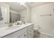 Bathroom featuring double sinks, white countertops and cabinets, a mirror, and a shower with a gray curtain at 705 Marshall Farm St, Wake Forest, NC 27587