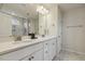 Bright bathroom with double vanity, quartz countertops, and a glass-enclosed shower at 705 Marshall Farm St, Wake Forest, NC 27587